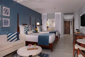 Double bed suite with blue and white decor
Secrets St. James Montego Bay Junior Suite Double